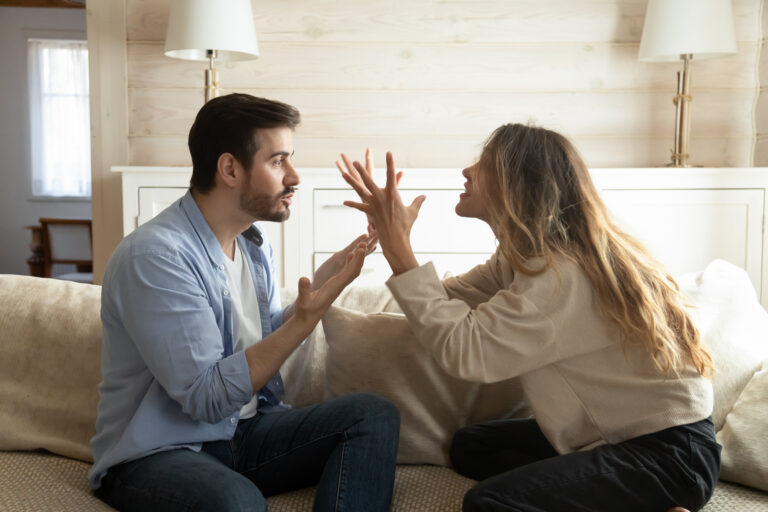 Emotional annoyed stressed couple arguing at home